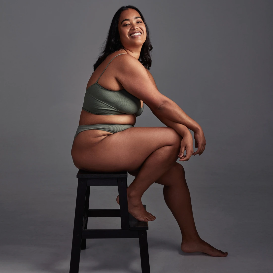 woman sitting on stool in photo studio | thigh lift in miami